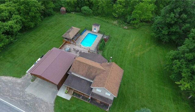 1 3-bedroom, 2 full bath home sitting on a park-like acre lot with in-ground, heated saltwater pool! $159,900