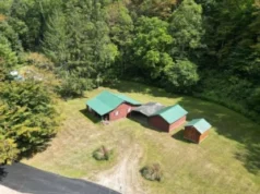 Nestled on over 12 acres of untouched timberland
