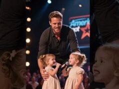 Two lovely twin girls singing to their father