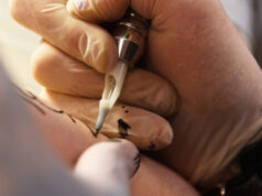 Heavily tattooed dad faces backlash before wife reveals the truth