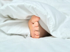 Why sleeping with one foot out might be the key to rest!