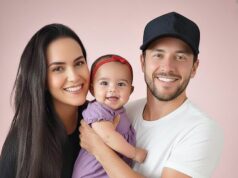 Young couple put daughter inside the fir…